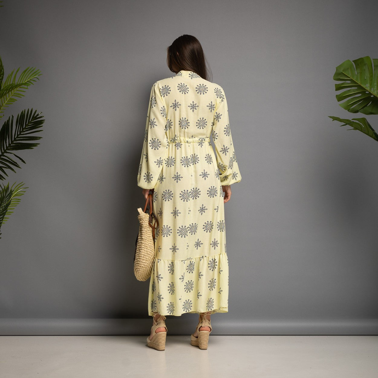 Pastel yellow printed maxi dress back view with long sleeves