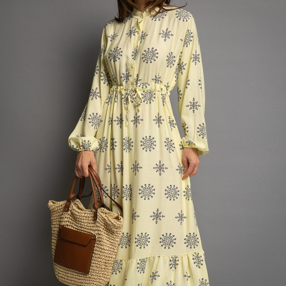 Detail of pastel yellow printed maxi dress with drawstring waist