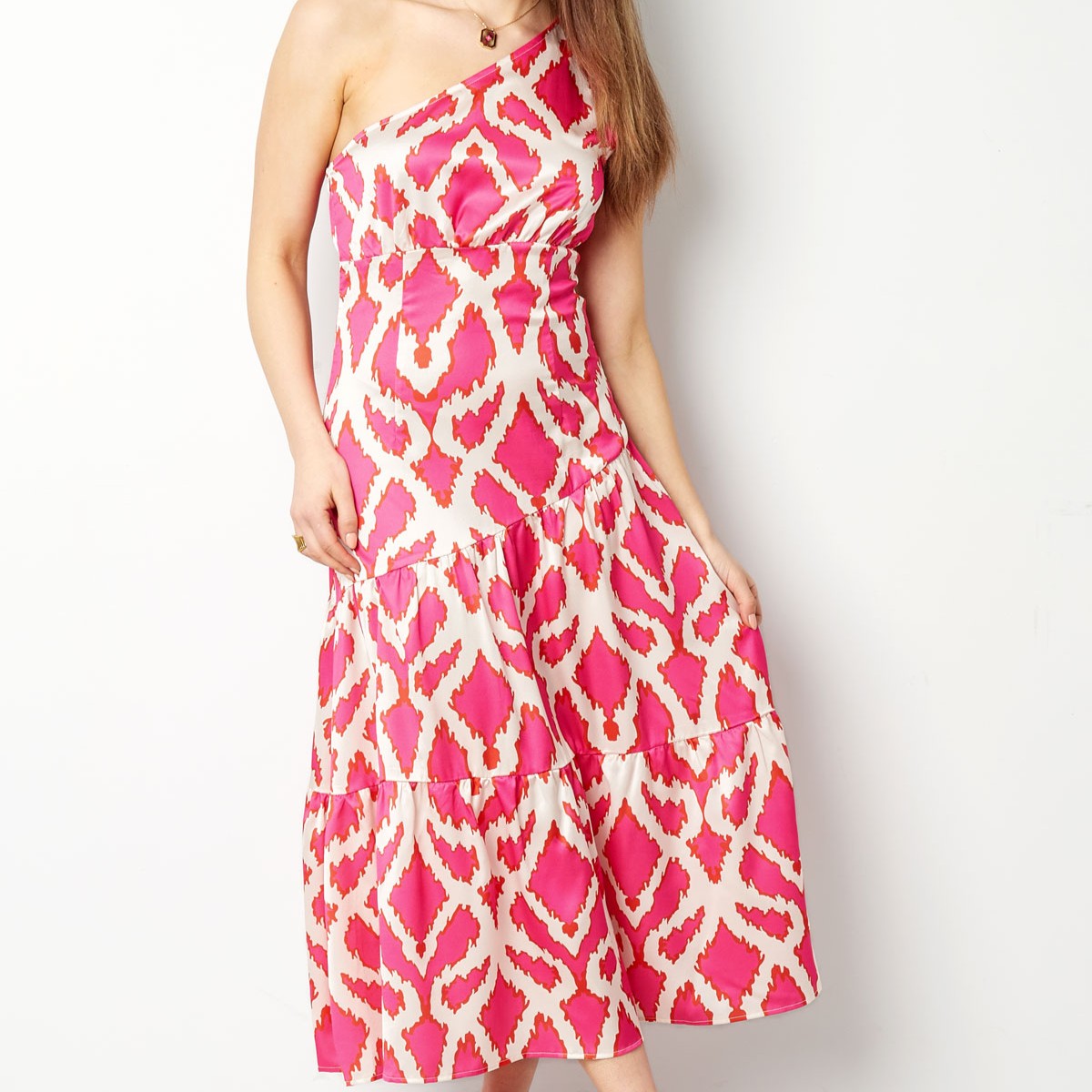 Pink geometric print one-shoulder midi dress isolated front side view
