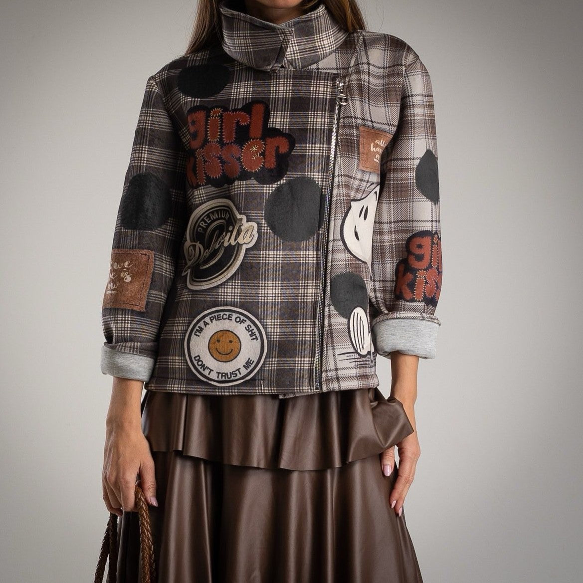 Front view of MARIΓIOÚ plaid neoprene jacket with Snoopy print and playful patches.