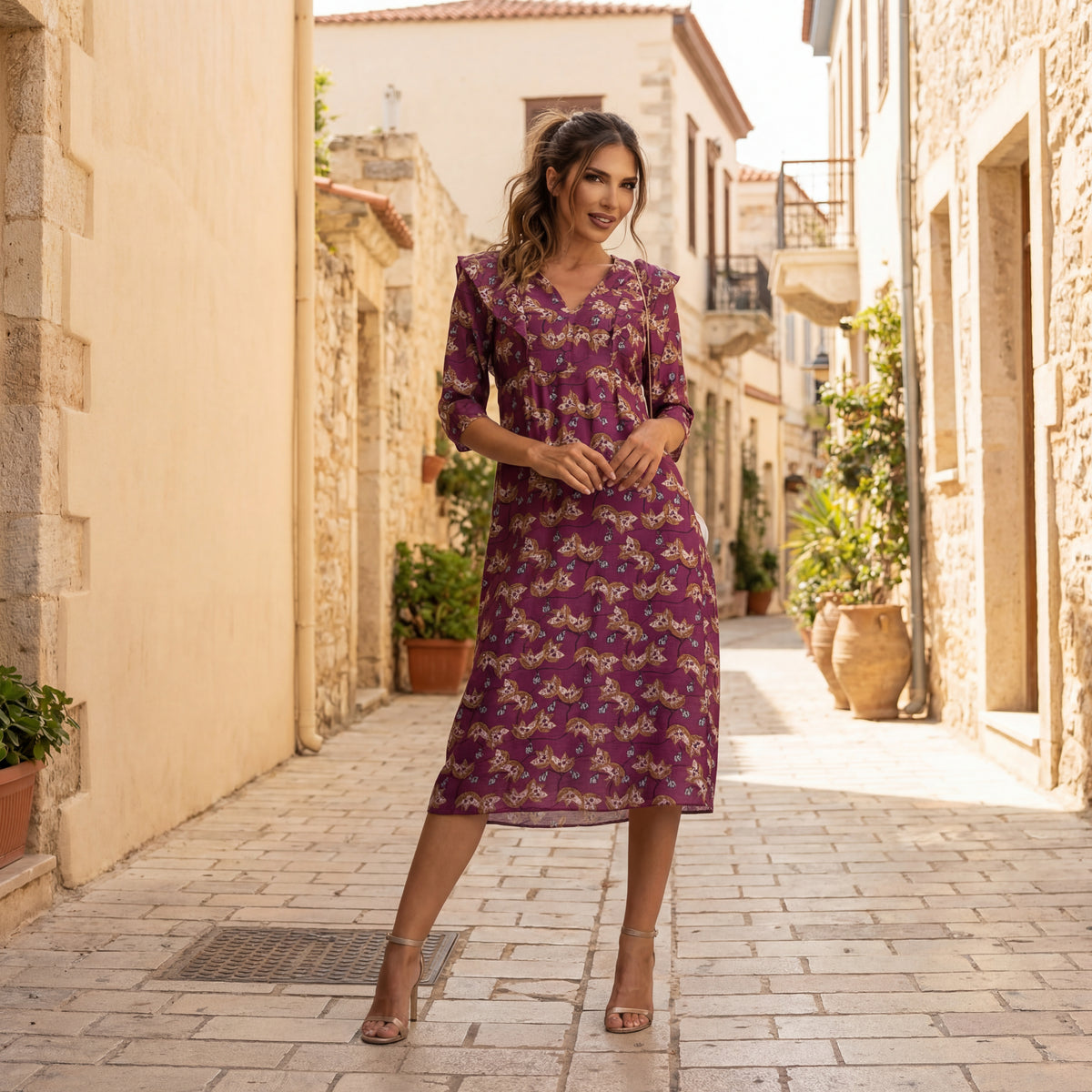 Elegant printed midi dress with a feminine silhouette styled in a refined streetstyle look