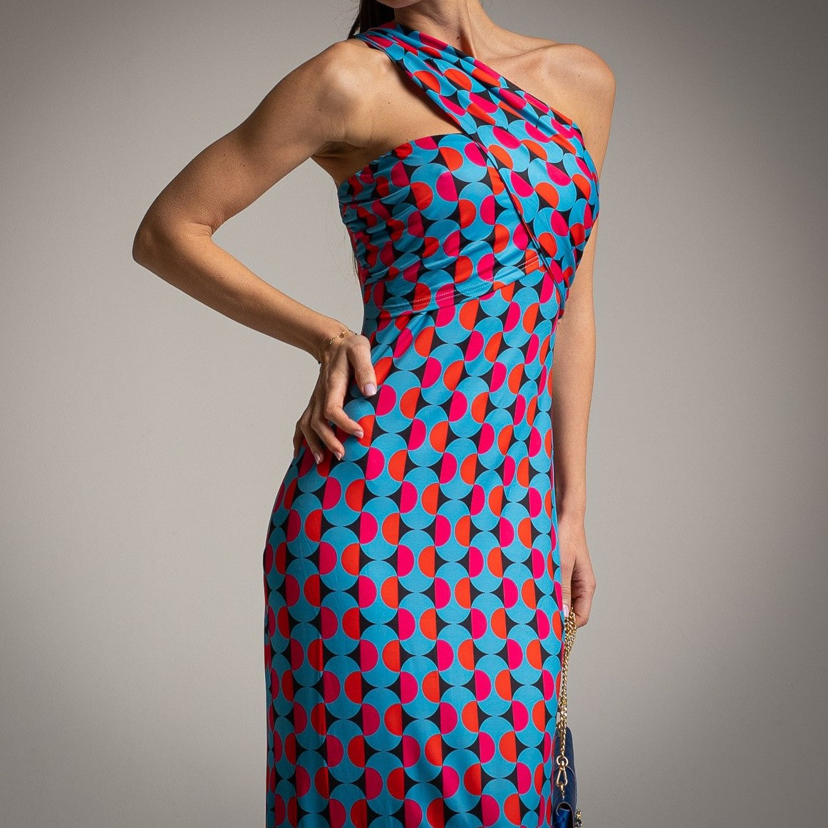 Black retro one-shoulder midi dress detail showing asymmetrical neckline and fitted waist