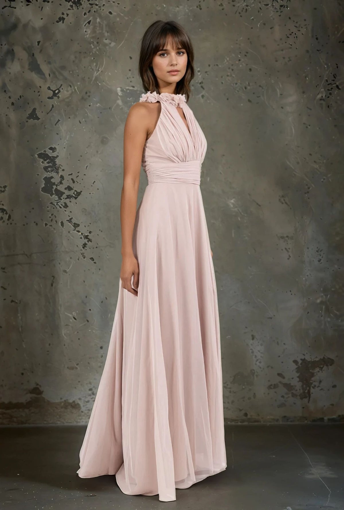 Side view of blush pink halterneck evening gown with floral collar detail – elegant bridesmaid or guest dress by MARIGIOÚ