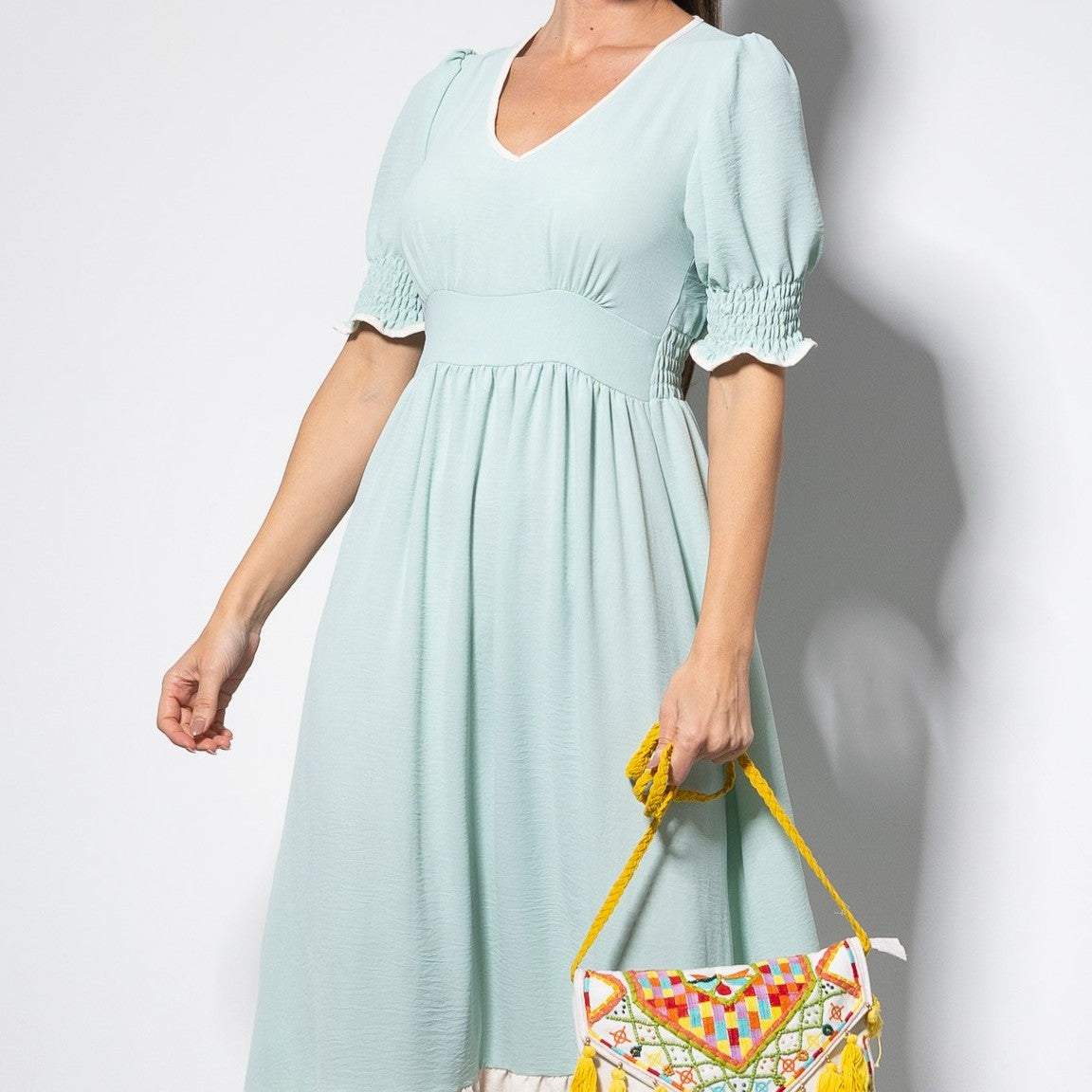 Romantic mint midi summer dress with V-neckline, puff sleeves and flowing skirt, front detail