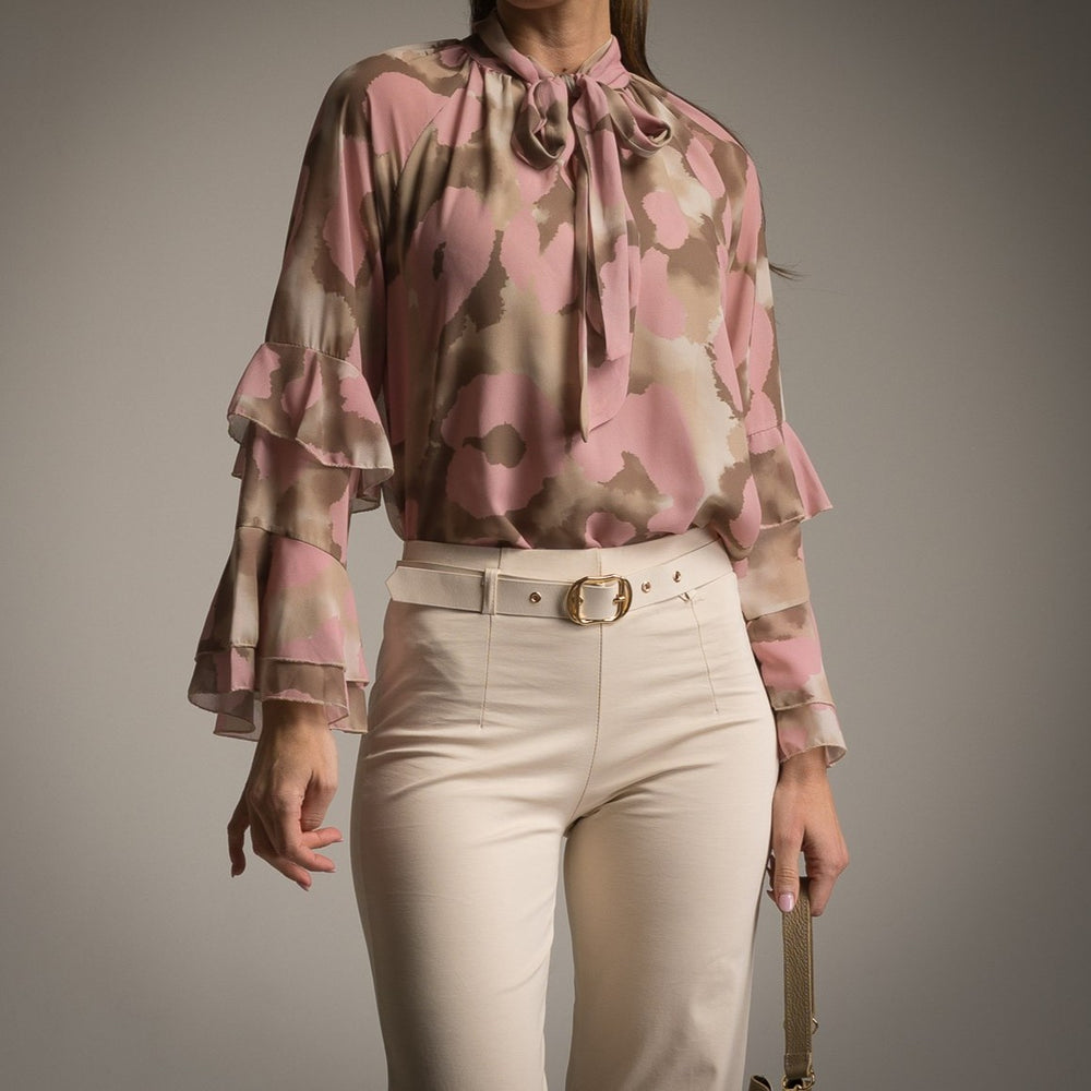 Close-up of rose watercolour print blouse with bow tie neckline