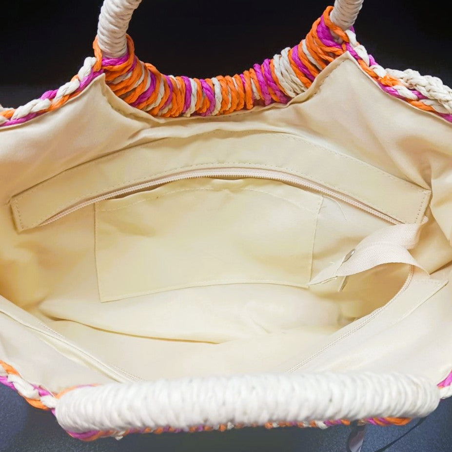 Interior view of the Sunset Woven Beach Bag featuring zip closure and storage pocket