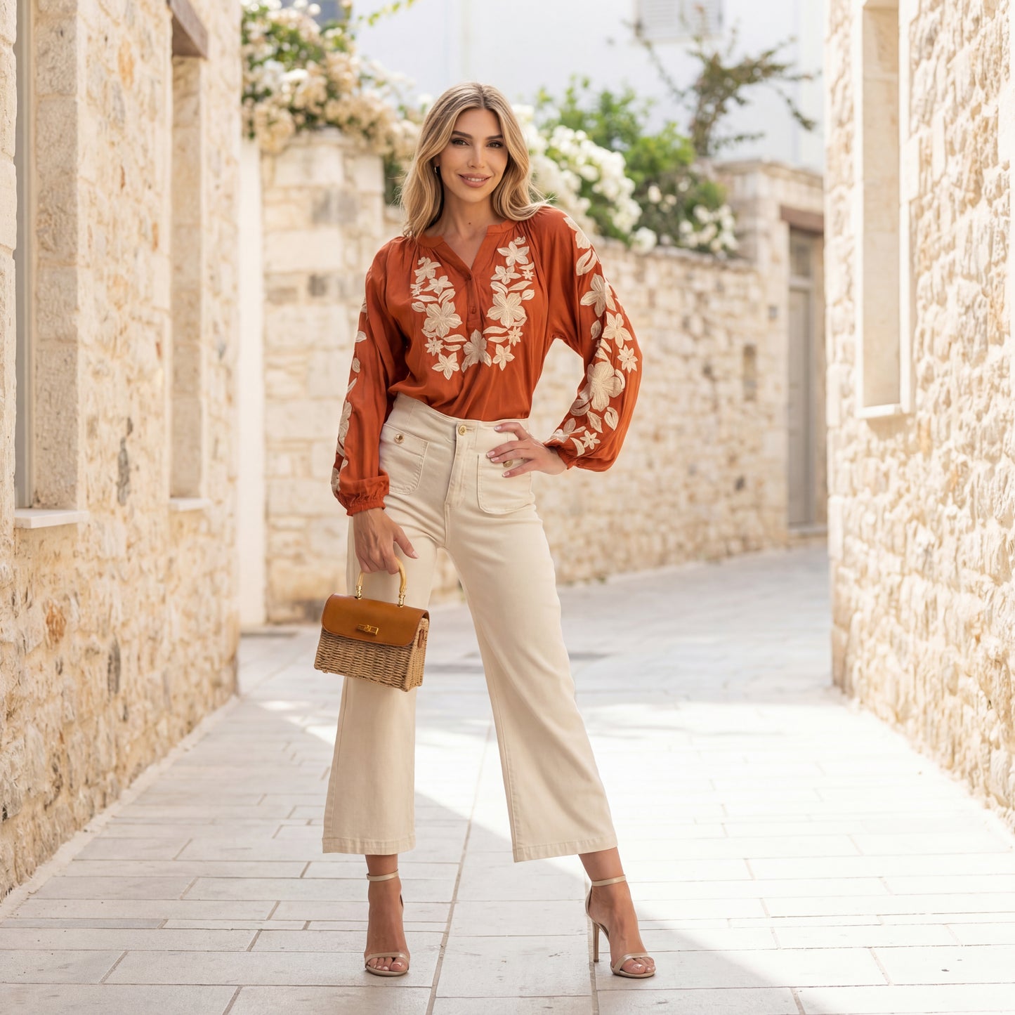 Teja embroidered blouse worn outdoors with light trousers