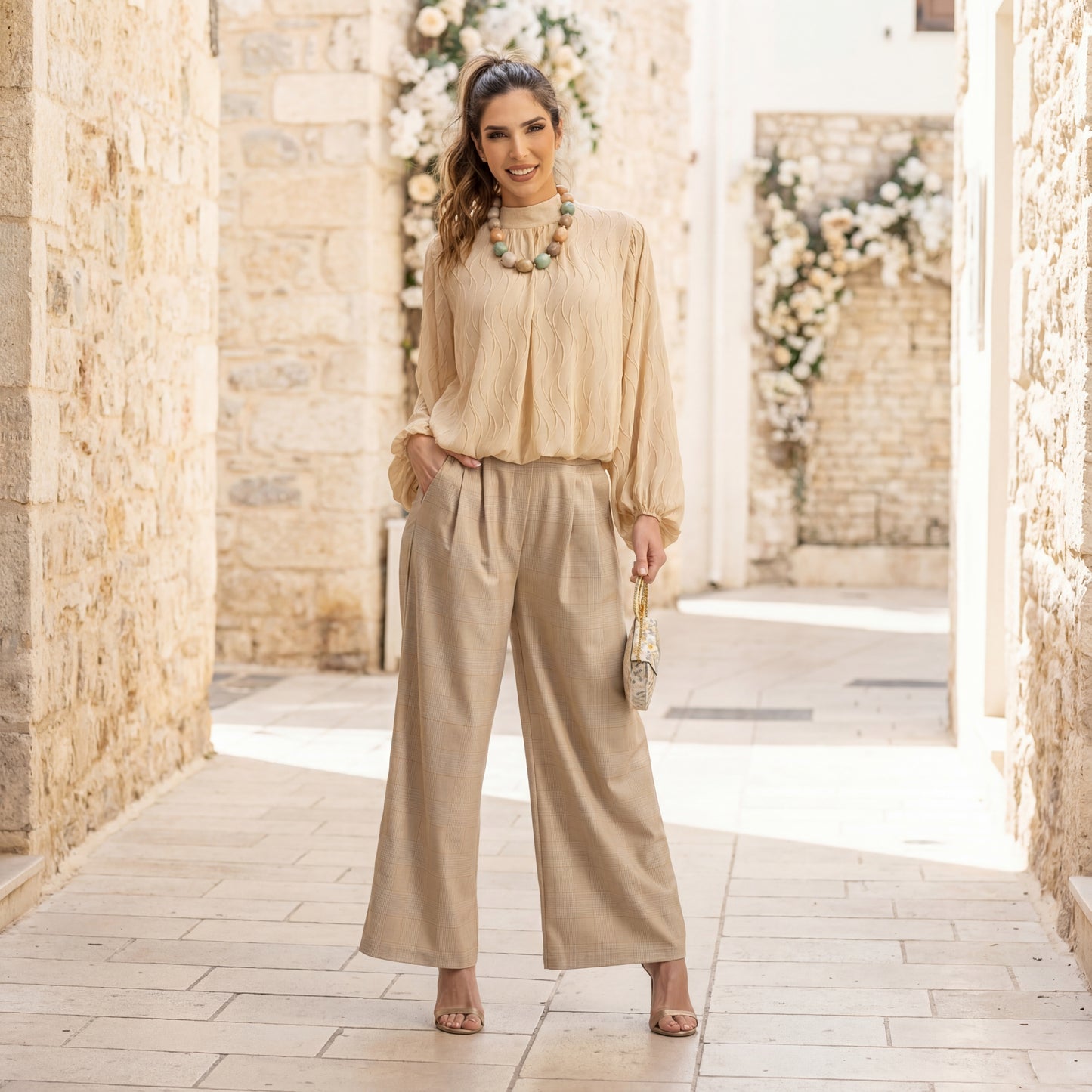 Full body look of beige textured wave blouse styled with trousers – MARIΓIOÚ