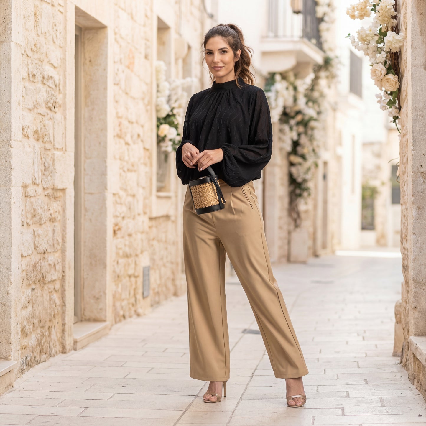 Full body look of black textured wave blouse styled with trousers – MARIΓIOÚ