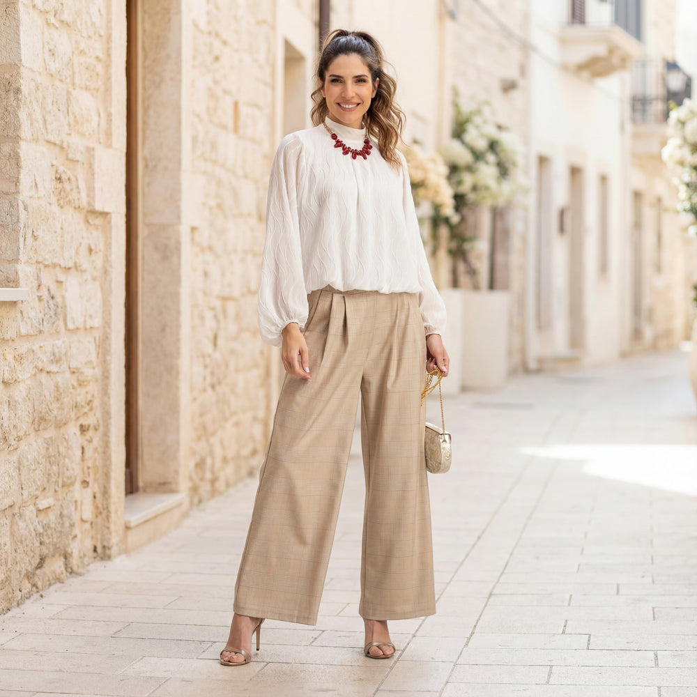 Full body look of white textured wave blouse in elegant setting – MARIΓIOÚ