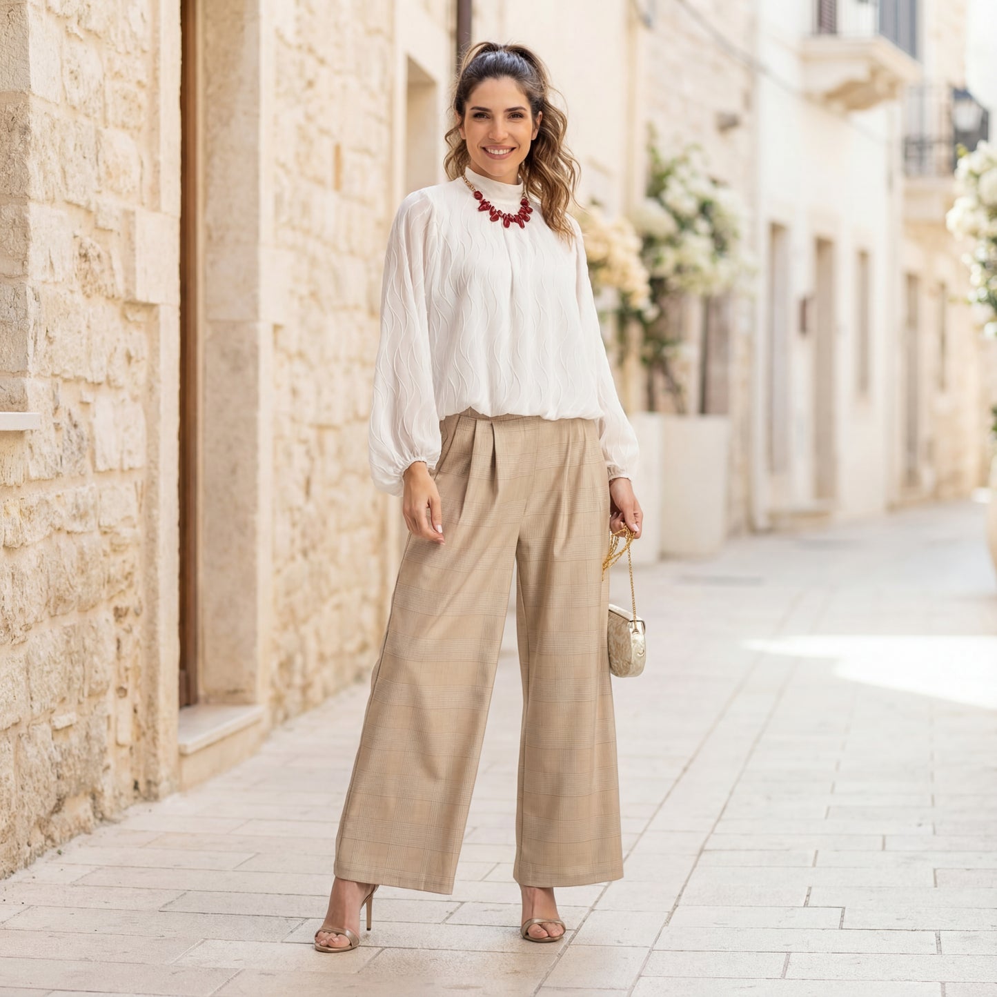 Full body look of white textured wave blouse in elegant setting – MARIΓIOÚ