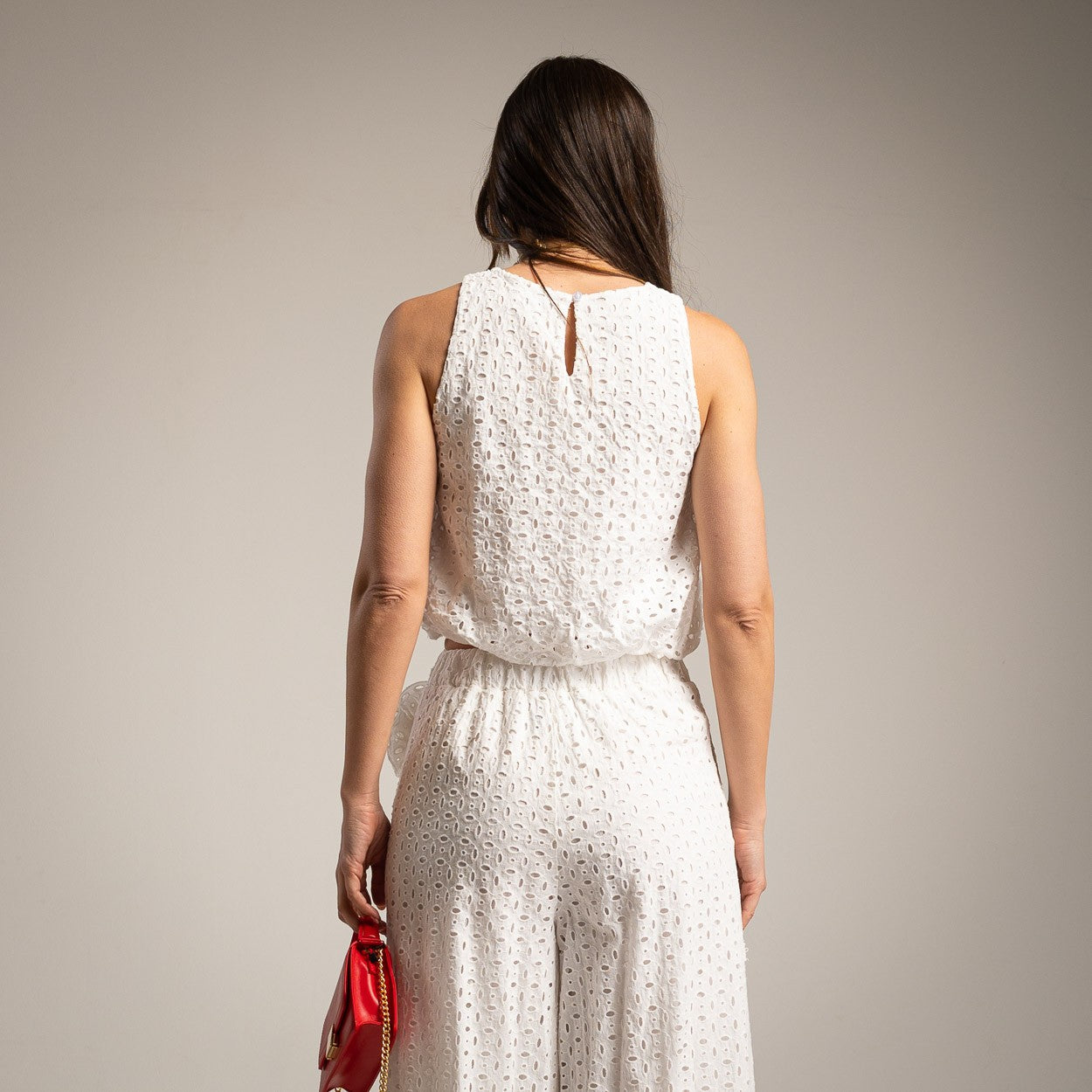 Back view of white broderie anglaise wide leg pants and sleeveless summer top set
