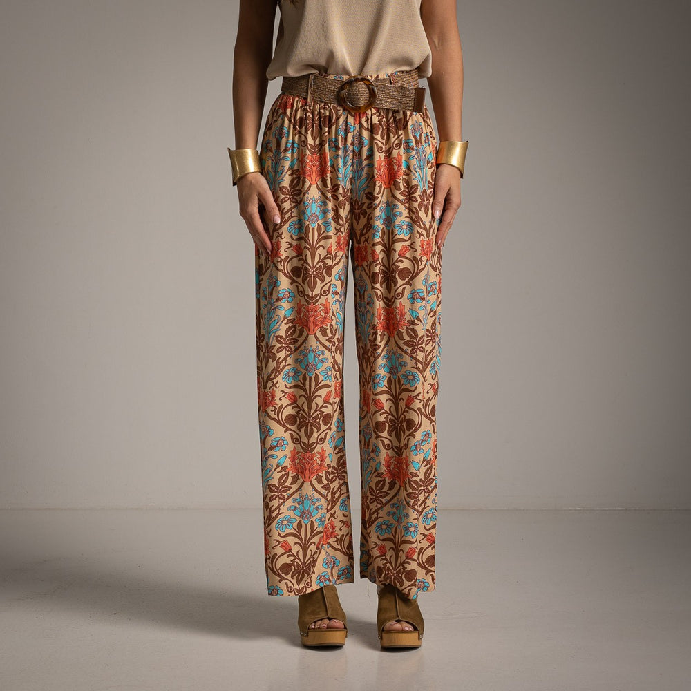 Front view of wide-leg pants featuring a sophisticated baroque floral print and matching woven belt.